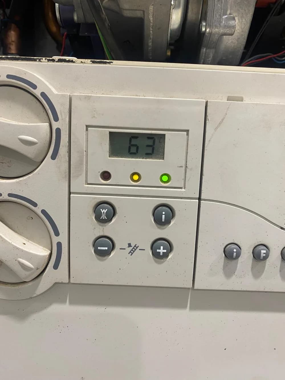 Vaillant boiler display reading 63 degrees with a healthy green light after the heat exchanger replacement