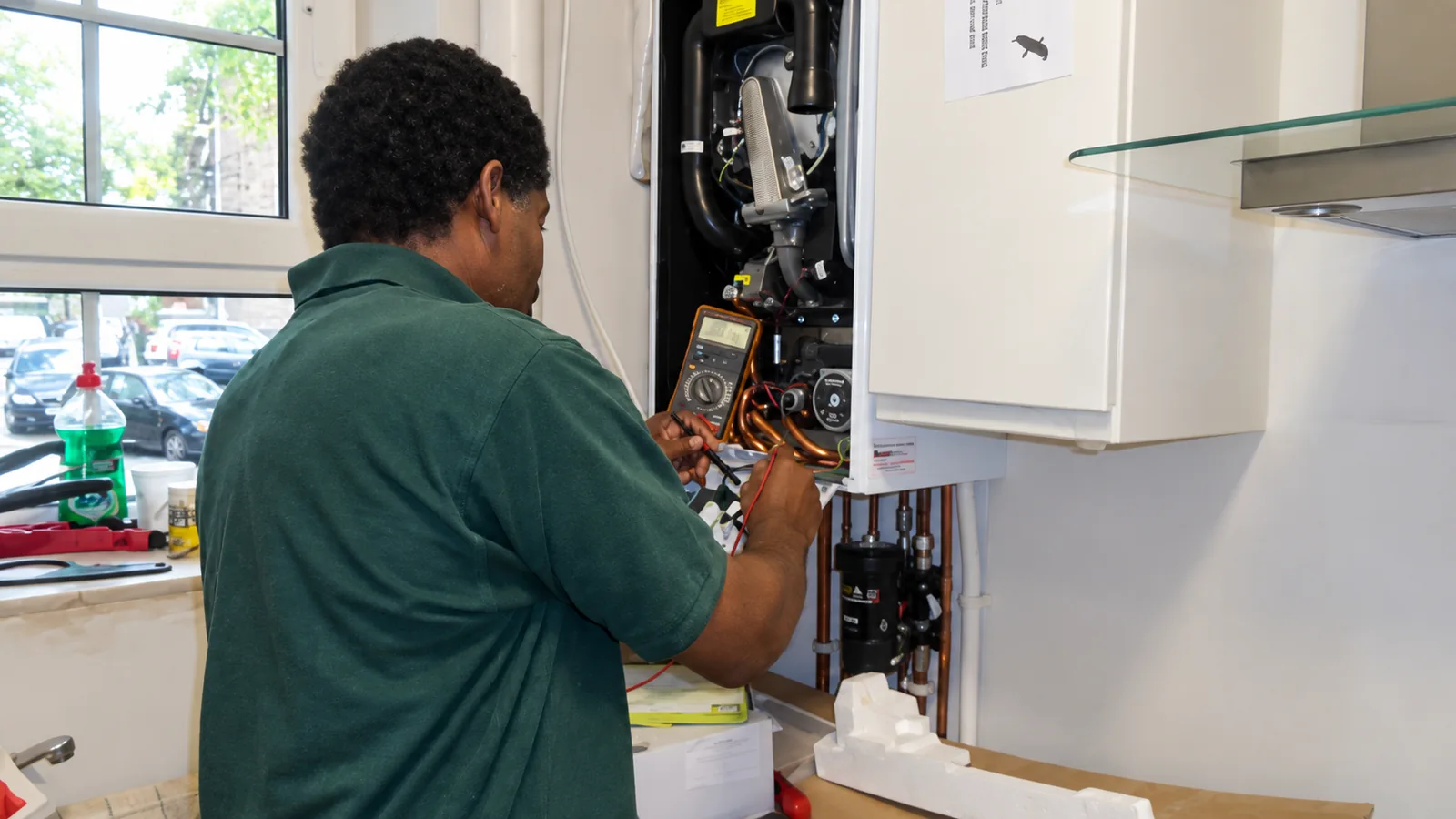 Carlton Fuller testing a boiler for a customer in South East London