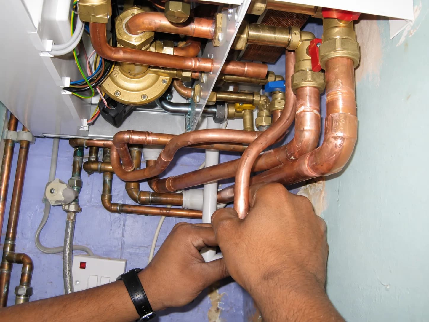 Carlton Fuller fitting copper pipework for a customer in Surrey