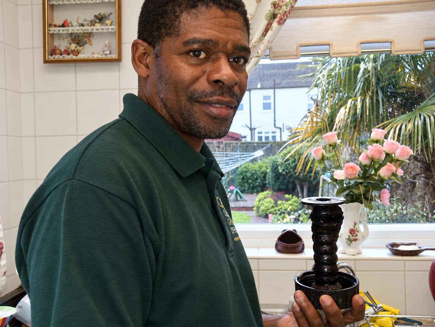 Carlton Fuller holding a heating filter