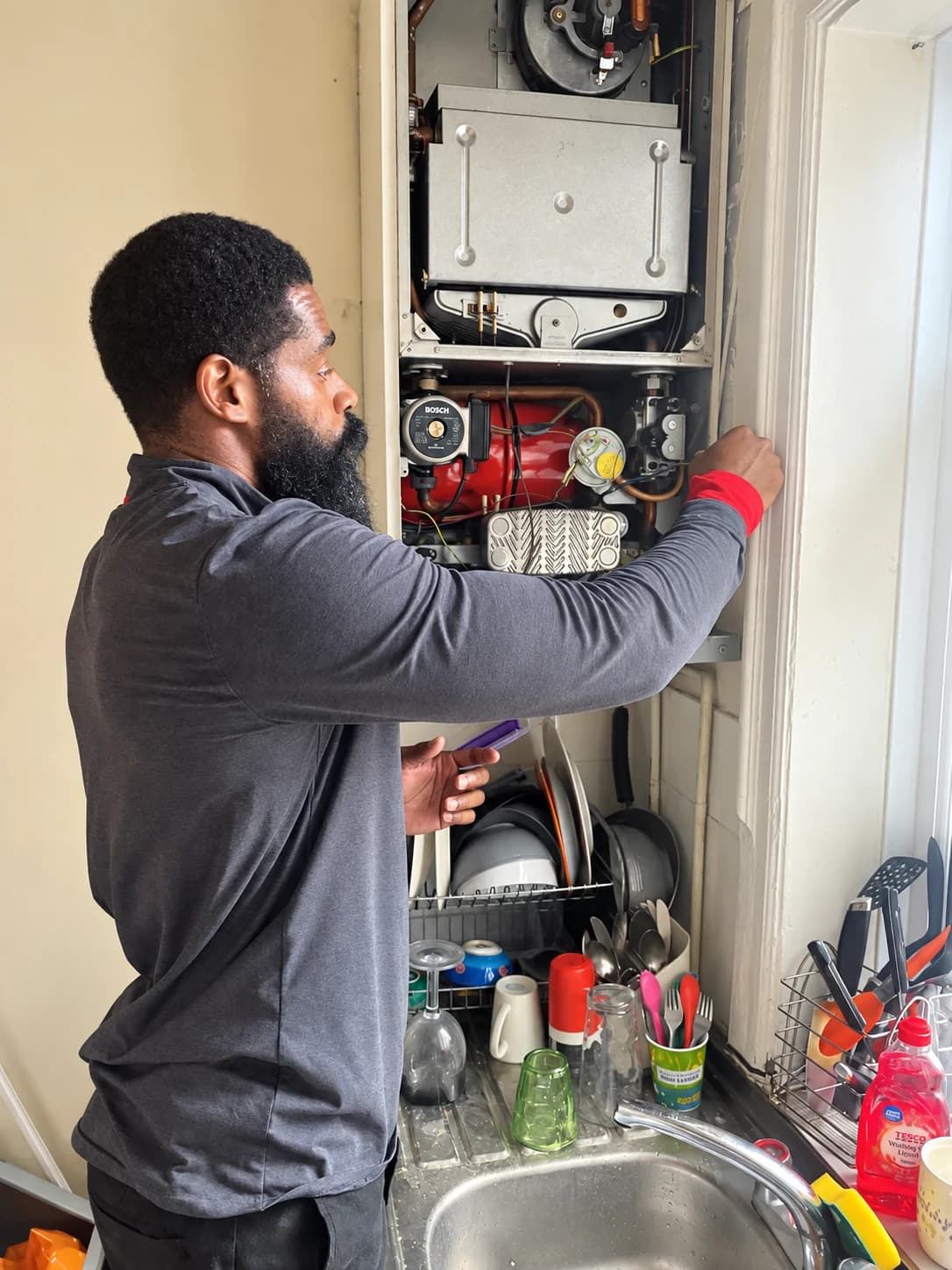 Simon Fuller working on a boiler